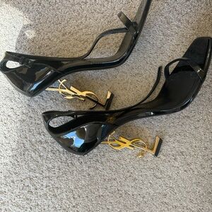 Yves Saint Laurent Black Heels with Gold Logo Accent